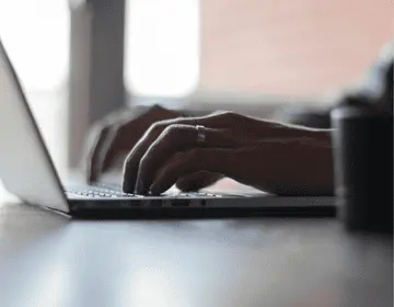 Person typing on laptop